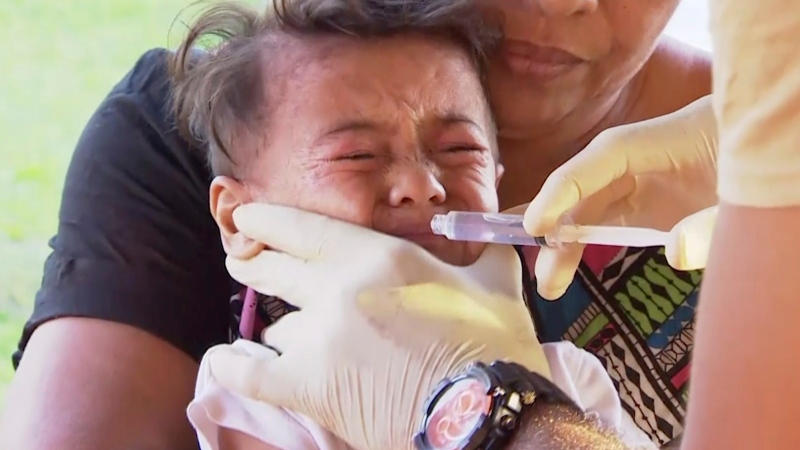 In this November 2019, image from video, a child gets vaccinated at a health clinic in Apia, Samoa. (TVNZ via AP)