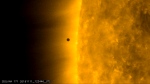 This still image from video issued by NASA's Solar Dynamics Observatory shows Mercury as it passes between Earth and the sun on Monday, Nov. 11, 2019. The solar system's smallest, innermost planet resembles a tiny black dot during the transit, which began at 7:35 a.m. EST (1205 UTC). (NASA Solar Dynamics Observatory via AP)