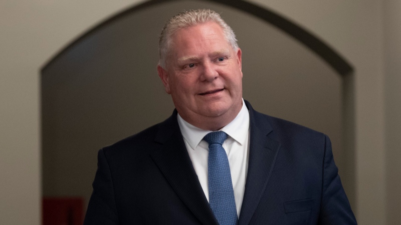 Premier of Ontario Doug Ford walks through the halls of Parliament to speak with the media following a meeting with Prime Minister Trudeau on Friday, Nov. 22, 2019 in Ottawa. THE CANADIAN PRESS/Adrian Wyld