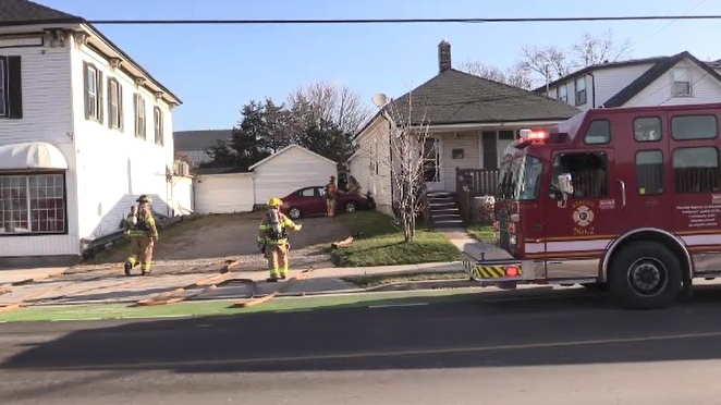 Firefighters work at the scene after a car hit a gas meter in east London, Ont. on Tuesday, Nov. 26, 2019. (Gerry Dewan / CTV London)