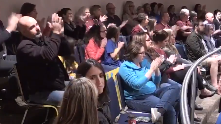Members of the public cheer as the Thames Valley District School Board in London, Ont. votes to keep two Elgin County public schools open on Tuesday, Nov. 26, 2019.
(Daryl Newcombe / CTV London) 