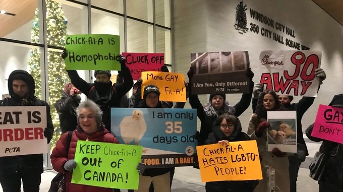 A group of people protest a proposed Chick-Fil-A out front of Windsor City Hall on Dec. 2, 2019 (Rich Garton / CTV Windsor)
