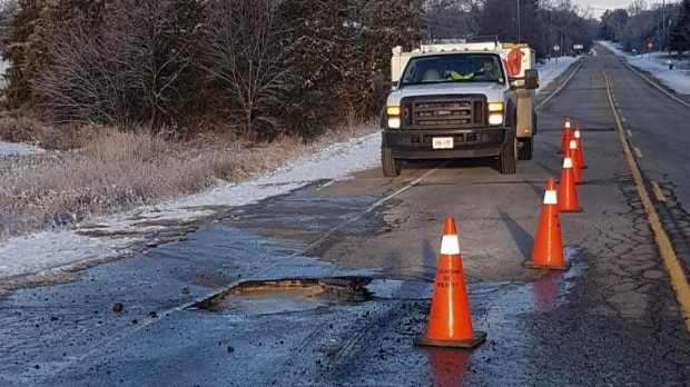 A metre-wide sink hole on a country road