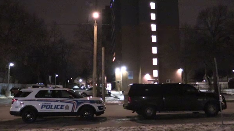 Police work at the scene of a standoff at an apartment building on Simcoe Street in London, Ont. on Thursday, Dec. 5, 2019. (Morgan Baker / CTV London)