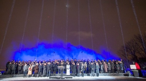Fourteeen beams of light point skyward during ceremonies to mark the 30th anniversary of the 1989 Ecole Polytechnique attack where a lone gunman killed 14 female students, Friday, December 6, 2019 in Montreal.THE CANADIAN PRESS/Ryan Remiorz