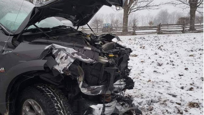A pickup truck is damaged after police say it collided with a farm vehicle near Listowel, Ont. on Wednesday, Dec. 11, 2019. (Facebook / OPP West Region) 