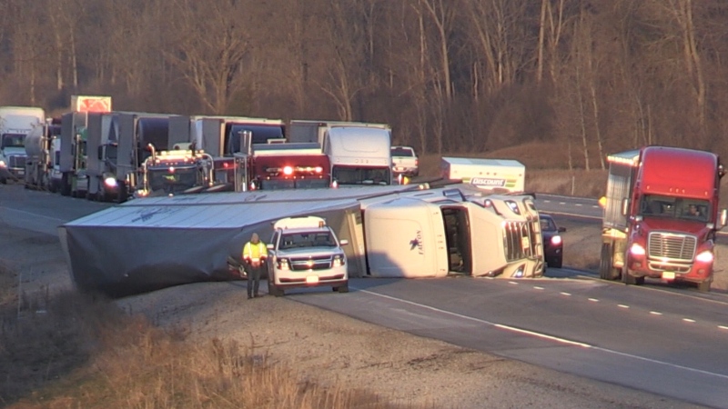An overturned transport truck blocked all lanes of Highway 401 west of London, Ont. on Wednesday, Dec. 11, 2019. (Jim Knight / CTV London)