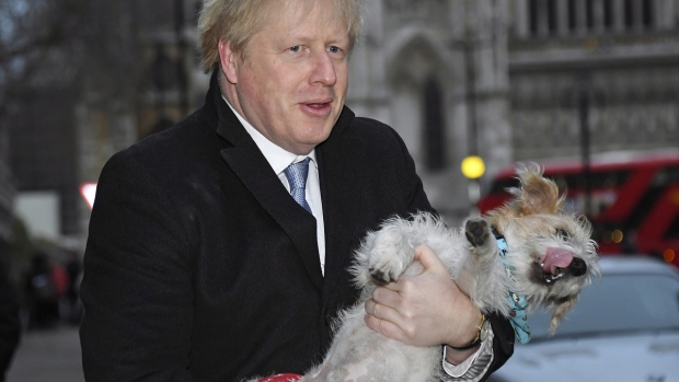 Boris Johnson holds his dog Dilyn