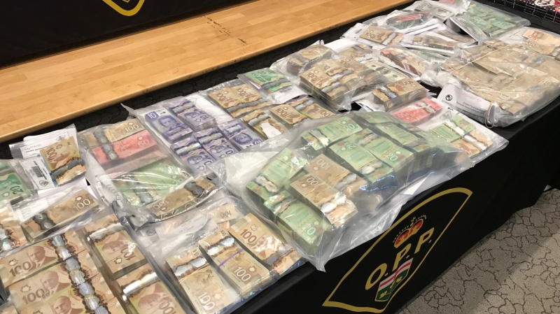 Provincial police seized more than $1.7M in cash displayed during a press conference at the OPP Headquarters in Orillia on Thurs., Dec. 19, 2019. (Jim Holmes/CTV Barrie)