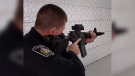 A police officer in Woodstock, Ont. practices with a 'new' used rifle on Thursday, Dec. 19, 2019. (Reta Ismail / CTV London)