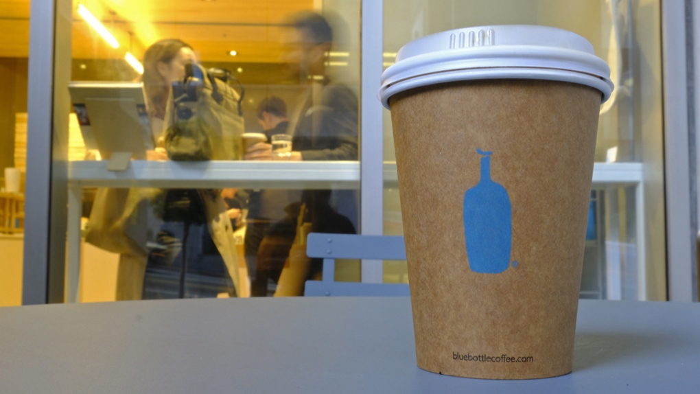 A Blue Bottle Coffee paper to-go cup
