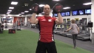 Chris Symons, assistant fitness manager at GoodLife Fitness, lifts some weights in London, Ont. on Friday, Dec. 27, 2019. (Celine Zadorsky / CTV London)