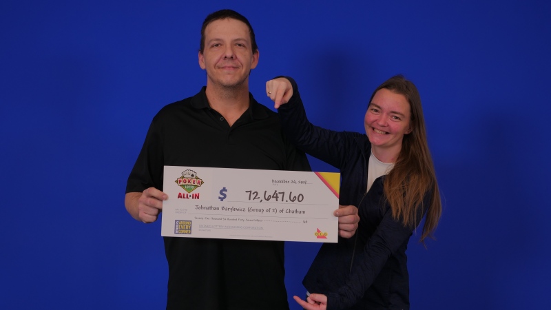 Johnathan Barylewicz and Maria Murray of Chatham collect their winning cheque in Toronto. (Courtesy OLG)