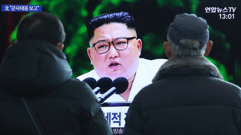 People watch a TV screen showing an image of North Korean leader Kim Jong Un during a news program at the Seoul Railway Station in Seoul, South Korea, Tuesday, Dec. 31, 2019. (AP Photo/Ahn Young-joon)