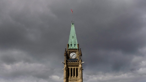 Storm clouds move in over the Peace Tower on Parliament Hill in Ottawa, Sunday, Sept. 13, 2009. (Adrian Wyld / THE CANADIAN PRESS)