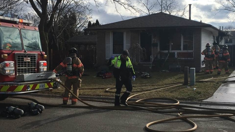 Emergency crews work at a house fire at 67 Patience Crescent in London, Ont. on Sunday, Jan. 5, 2020. (Brent Lale / CTV London)