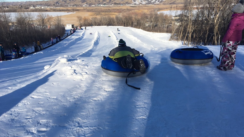 A child prepares to slide down the Tube Park at Mission Ridge Winter Park in January 2020. (Cole Davenport/CTV News)