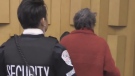 Anna Maria Valastro is escorted from a meeting in city council chambers  in London, Ont. on Tuesday, Jan. 7, 2020. (Daryl Newcombe / CTV London)