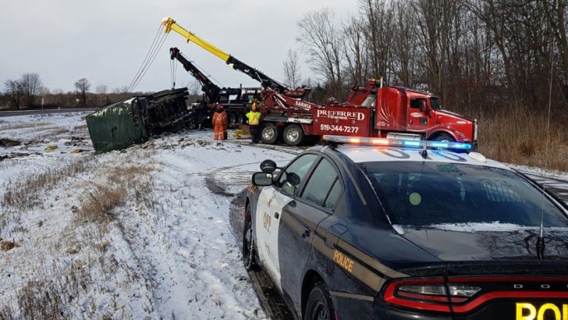 Crews work to clear a crash on Highway 402 near Glendon Drive in Middlesex County, Ont. on Wednesday, Jan. 8, 2020. (OPP West Region / Facebook)