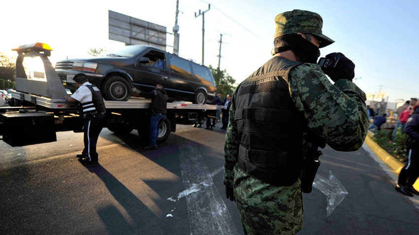 A soldier patrols the streets in Guadalajara