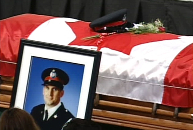 Thousands gather to remember York Regional Police Const. Robert Plunket at the Ray Twinney Recreation Complex in Newmarket, Ont. on Wednesday, Aug. 8, 2007.