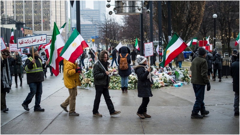 A rally in solidarity with Iranian Protests takes place in Mel Lastman Square by the memorial for the Iran plane crash victims in Toronto on Monday January 13, 2020. THE CANADIAN PRESS/Aaron Vincent Elkaim