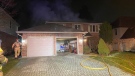 Smoke can be seen coming from a home on Lavender Way in north London on Monday, Jan, 13, 2020. (Courtesy London Fire Department) 