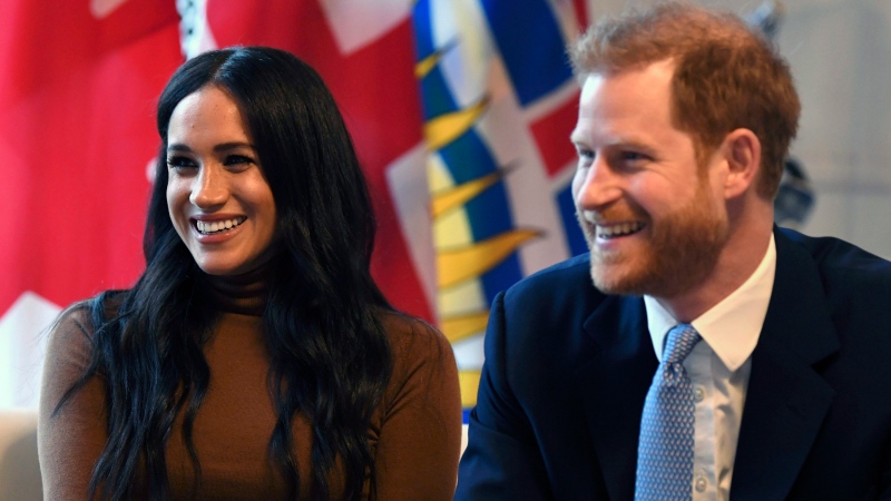 Prince Harry and Meghan, Duchess of Sussex smile during their visit to Canada House in thanks for the warm Canadian hospitality and support they received during their recent stay in Canada, in London, Jan. 7, 2020. (Daniel Leal-Olivas/Pool Photo via AP)