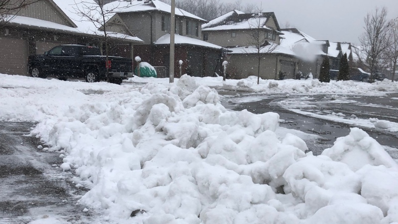 Icy snow is seen at the foot of a driveway in St. Thomas, Ont. in this image shared Sunday, Jan. 19, 2020. (Adam McBurney / Twitter)