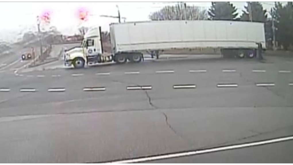 A transport truck driving through an intersection