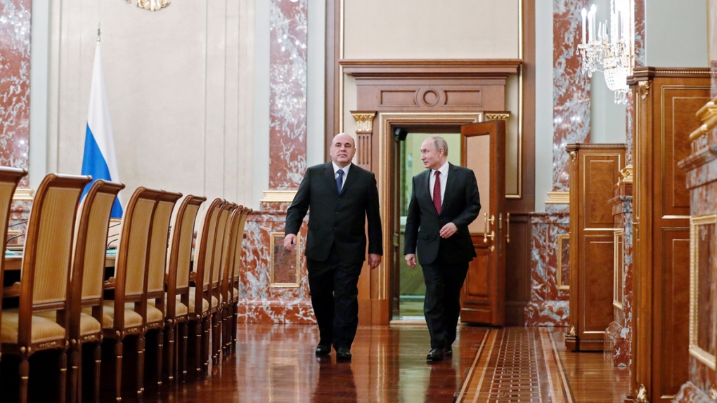 Putin, right, and PM Mikhail Mishustin 