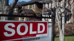 A sold sign is shown in front of west-end Toronto homes Sunday, April 9, 2017. Private listings and other alternative sales models are still outliers in Canada's real estate market, despite the Competition Bureau's success after seven years of litigation to force the Toronto board to share data on sale prices and listing history online. THE CANADIAN PRESS/Graeme Roy