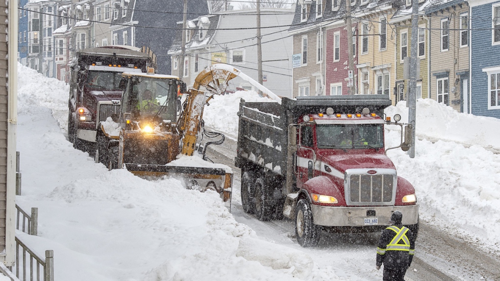 Workers remove snow from the streets in St. John's