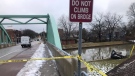 The Windsor Police Service investigates a single-vehicle crash that saw a vehicle end up on the banks of Little River on Jan. 25, 2020. (Alana Hadadean/CTV Windsor)