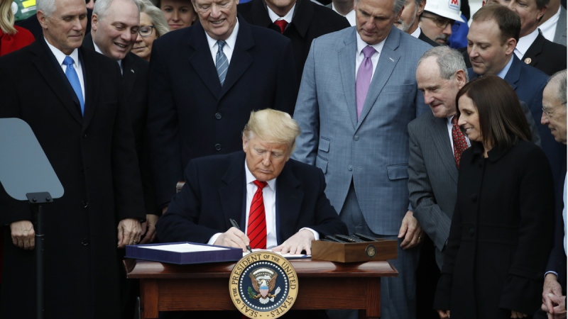 U.S. President Donald Trump signs the new NAFTA agreement, on Jan. 29, 2020. (Alex Brandon / AP)
