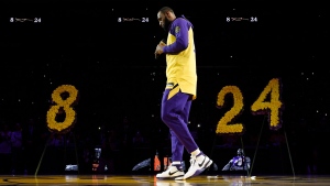 Los Angeles Lakers forward LeBron James looks down while speaking to the crowd about Kobe Bryant, prior to the team's NBA basketball game against the Portland Trail Blazers in Los Angeles, Friday, Jan. 31, 2020. (AP / Kelvin Kuo)