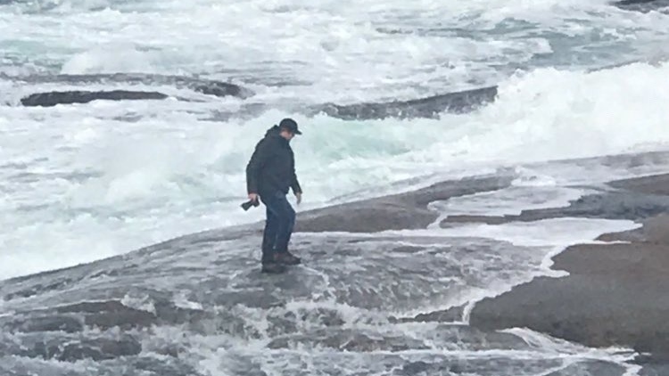 Pictures emerged online this weekend of a man coming dangerously close to the water's edge at Peggy's Cove during some rough and windy weather. (Source: Halifax Noise)
