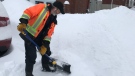 Dean Beneteau, 58, digs out a driveway Friday morning after 14 cm of snow fell on the Capital. Beneteau regularly shovels 27 driveways in the Alta Vista area throughout the winter. 