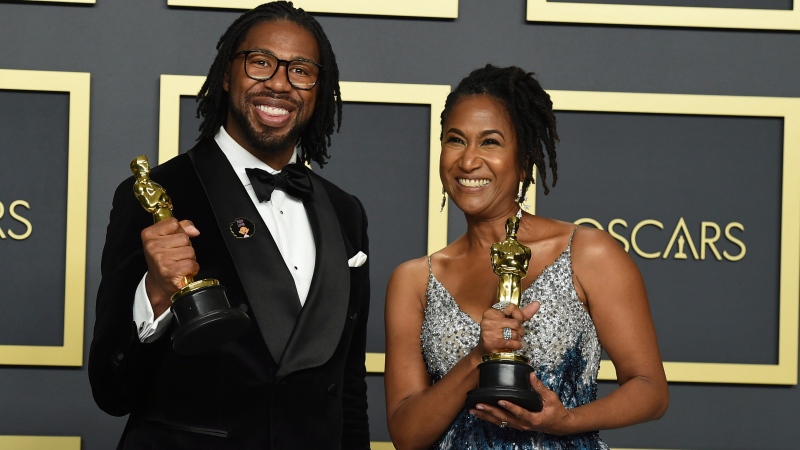 Matthew A. Cherry, left, and Karen Rupert Toliver, winners of the award for best animated short film for "Hair Love", pose in the press room at the Oscars on Sunday, Feb. 9, 2020, at the Dolby Theatre in Los Angeles. (Photo by Jordan Strauss/Invision/AP)