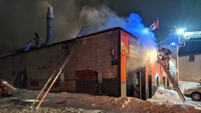 Firefighters battle a blaze at an auto body shop on Gladstone Avenue Sat., Feb. 15, 2020. (Photo: Scott Stilborn, @OFSFirePhoto / Twitter)