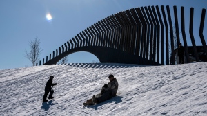 People go tobogganing at Lansdowne Park in Ottawa on Family Day, Monday, Feb. 17, 2020. (Justin Tang/The Canadian Press)