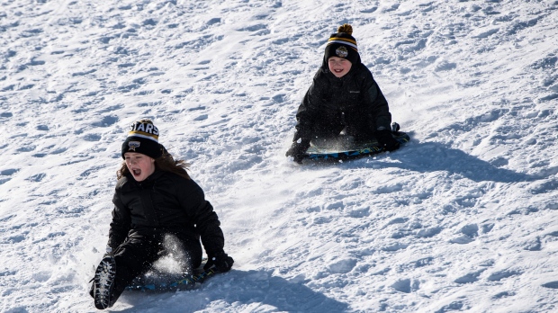 Kids go tobogganing at Lansdowne Park in Ottawa on Family Day, Monday, Feb. 17, 2020. (Justin Tang/The Canadian Press)