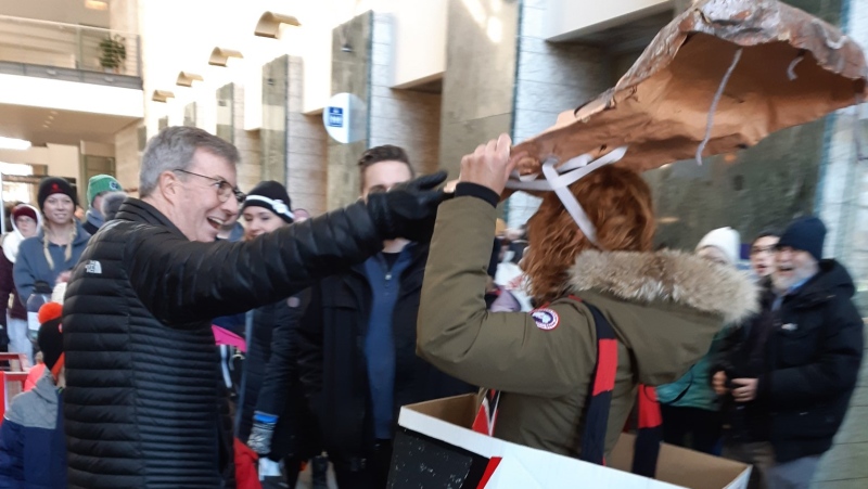 Velvet Leclair (right) has a run-in at Ottawa City Hall with Mayor Jim Watson while protesting the issues with the Confederation LRT line. (Courtesy: Marnie Wellar) 