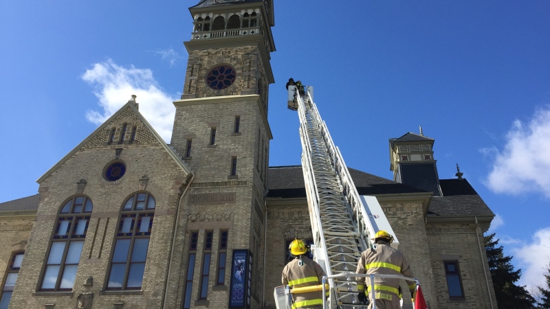 Firefighters use their new ladder truck to restore stained glass windows at Victoria Playhouse Petrolia.
(Bryan Bicknell, CTV London)