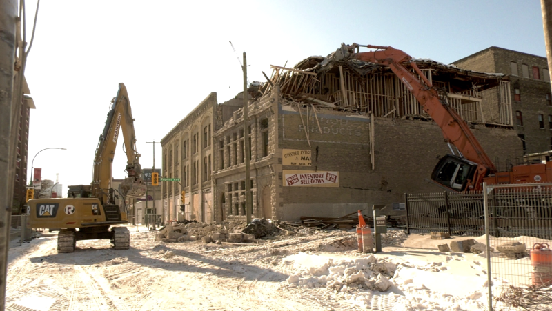 Crews have begun demolishing a historic building in the Exchange District. (source: Glenn Pismenny/ CTV News Winnipeg)