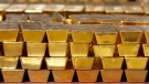 In this Tuesday, July 22, 2014, file photo, gold bars are stacked in a vault at the United States Mint, in West Point, N.Y. (AP Photo/Mike Groll, File)