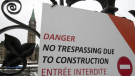 A construction sign hangs on the Queen's Gates on Parliament Hill in Ottawa, Monday January 27, 2020. (Adrian Wyld/THE CANADIAN PRESS)