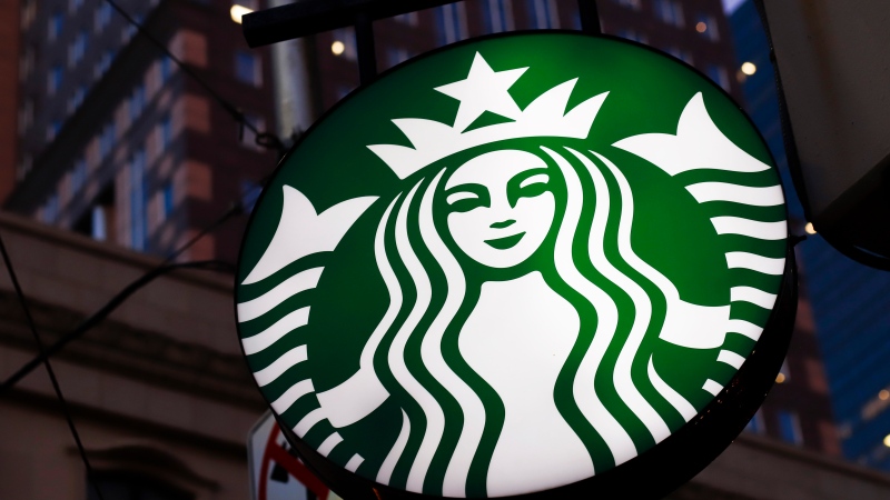 This June 26, 2019, photo shows a Starbucks sign outside a Starbucks coffee shop in downtown Pittsburgh. Starbucks customers in Canada will soon be able to down fake meat with their Frappuccinos. The coffee chain said Wednesday, Feb. 26, 2020, that it will soon start selling a sandwich featuring a meat-free patty from Beyond Meat, the El Segundo, California-based company whose patties are already found at other fast food chains. (AP Photo/Gene J. Puskar)