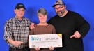 From left, Gordon, Margaret and Travis Gledhill pick up their winning lotto cheque in Toronto, Ont.