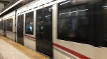 An LRT train rushes by the platform at Rideau Station. (Ted Raymond / CTV News Ottawa)